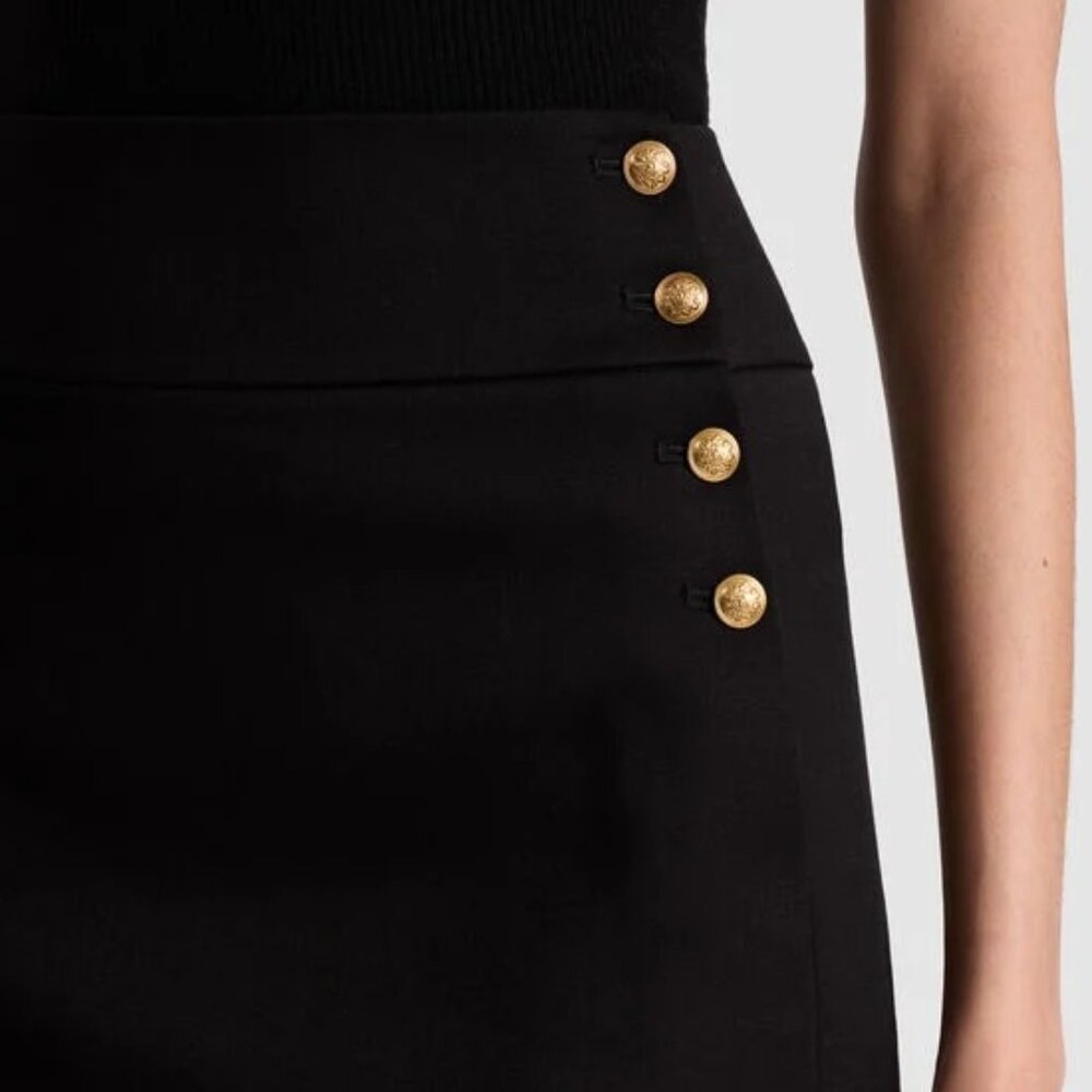Alice + Olivia black mini skirt with gold button